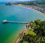 A long pier over a body of water

Description automatically generated
